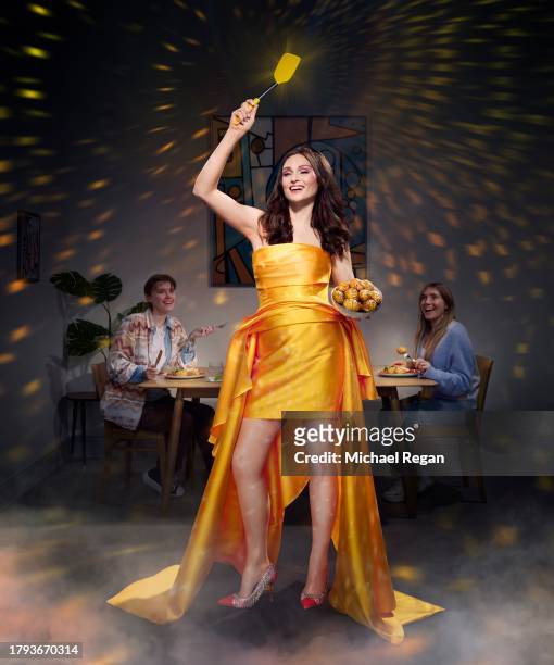 In this image released on November 21 Sophie Ellis-Bextor celebrates saving a couple from a boring dinner in a new campaign to launch McCain Baby...
