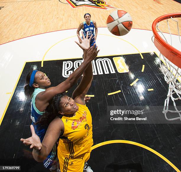 Kara Braxton of the New York Liberty fouls Courtney Paris of the Tulsa Shock late in the fourth quarter during the WNBA game on September 1, 2013 at...