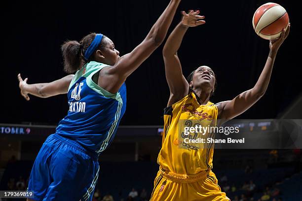 Kara Braxton of the New York Liberty defends Tiffany Jackson-Jones of the Tulsa Shock during the WNBA game on September 1, 2013 at the BOK Center in...