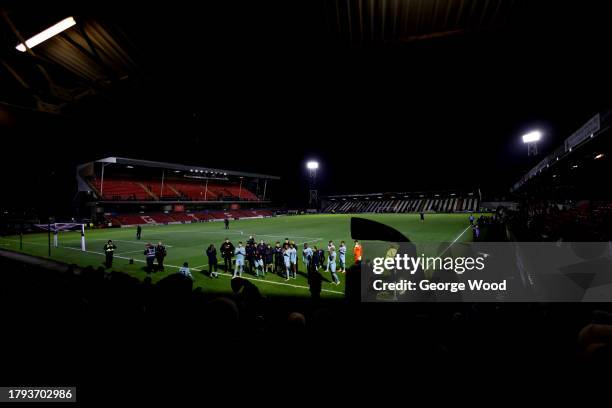 Slough Town players celebrate with fans after the Emirates FA Cup First Round Replay match between Grimsby Town and Slough Town at Blundell Park on...