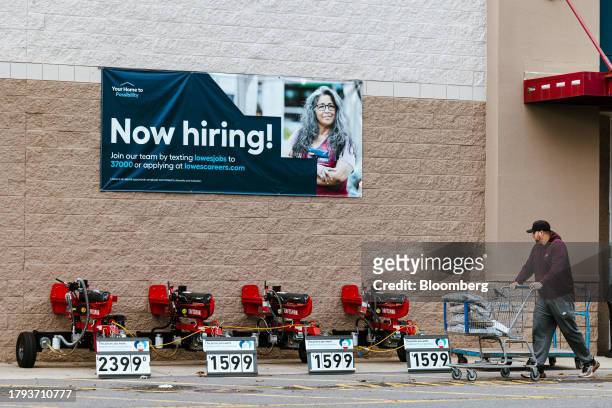 Now Hiring" sign at a Lowe's store in Glenmont, New York, US, on Tuesday, Nov. 14, 2023. Lowe's Cos. Is expected to release earnings figures on...