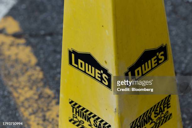 Safety cone outside a Lowe's store in Glenmont, New York, US, on Tuesday, Nov. 14, 2023. Lowe's Cos. Is expected to release earnings figures on...