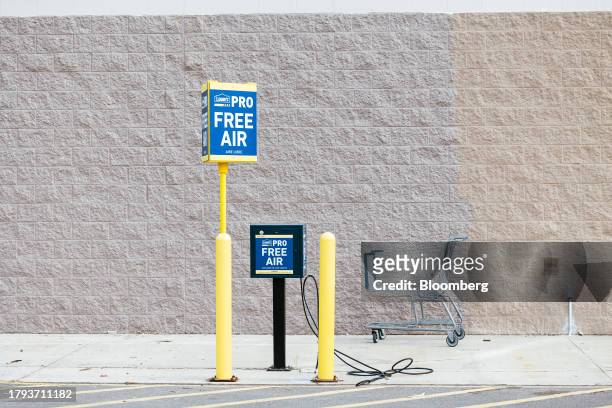 Free air compressor outside a Lowe's store in Hudson, New York, US, on Tuesday, Nov. 14, 2023. Lowe's Cos. Is expected to release earnings figures on...