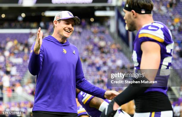 Head coach Kevin O'Connell of the Minnesota Vikings greets Harrison Smith before the game against the New Orleans Saints at U.S. Bank Stadium on...