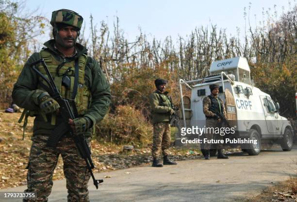 November 17 Srinagar Kashmir, India : Indian paramilitarily soldiers stand guard near the site in south Kashmir's Kulgam district where five...