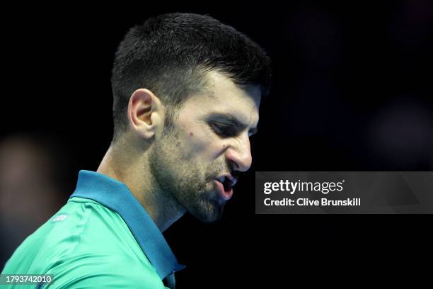 Novak Djokovic of Serbia reacts against Jannik Sinner of Italy during the Men's Singles Round Robin match on day three of the Nitto ATP Finals at...