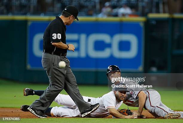 Jose Altuve of the Houston Astros cannot a play at second base in the fourth inning on Clete Thomas of the Minnesota Twins at Minute Maid Park on...