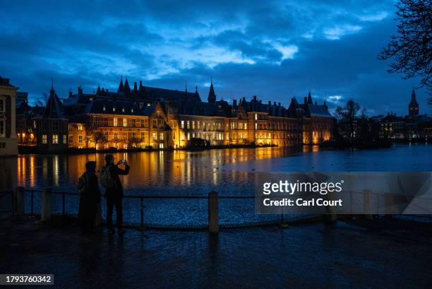 Man photographs the Dutch parliament building on November 20, 2023 in The Hague, Netherlands. A snap general election is due to be held on 22...