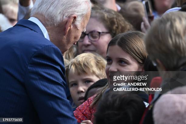 President Joe Biden greets guests as he takes part of the annual Thanksgiving Turkey pardon on the South Lawn of the White House in Washington, DC on...