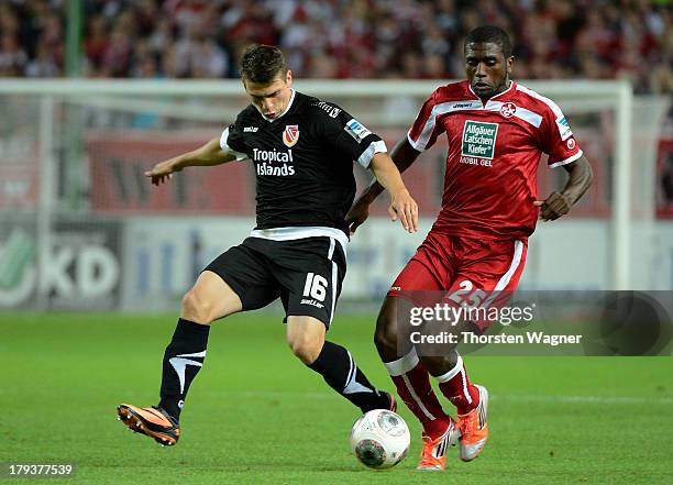 Olivier Occean of Kaiserslautern battles for the ball with Daniel Svab of Cottbus during the second Bundesliga match between 1.FC Kaiserslautern and...