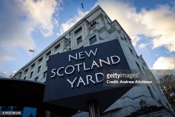 The New Scotland Yard sign and building, the headquarters of the the Metropolitan Police, the police force responsible for policing the boroughs of...