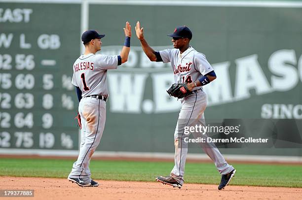 Jose Iglesias congratulates teamate Austin Jackson of the Detroit Tigers after defeating the Boston Red Sox at Fenway Park on September 2, 2013 in...