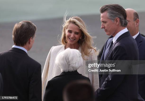 California Governor Gavin Newsom and his wife Jennifer Siebel Newsom talk with U.S. Treasury Secretary Janet Yellen as they await the arrival of...