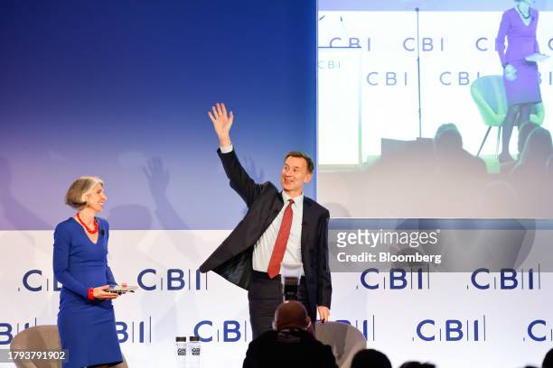 Jeremy Hunt, UK chancellor of the exchequer, right, and Rain Newton-Smith, director general of the Confederation of British Industry, at the "CBI...