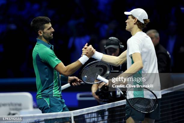 Jannik Sinner of Italy and Novak Djokovic of Serbia interact at the net after their Men's Singles Round Robin match on day three of the Nitto ATP...