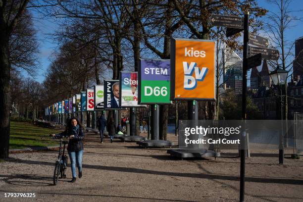 Woman walks past campaign posters on November 20, 2023 in The Hague, Netherlands. A snap general election is due to be held on 22 November in the...
