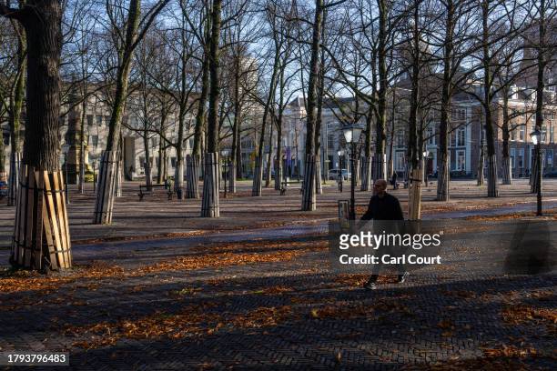 Man walks through a park on November 20, 2023 in The Hague, Netherlands. A snap general election is due to be held on 22 November in the Netherlands...