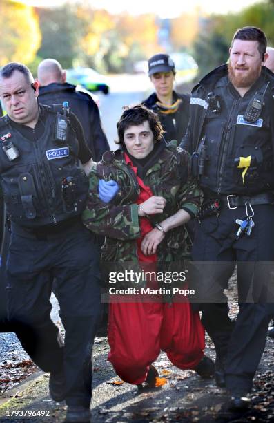 An activist is arrested and carried away by police officers on November 20, 2023 in Leicester, United Kingdom. Activists with the group Palestine...
