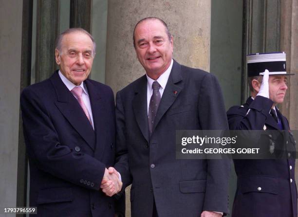 Azerbaijan President Heydar Aliev is greeted by French counterpart Jacques Chirac at the Elysee Palace in Paris 05 March 2001. Both will discuss...