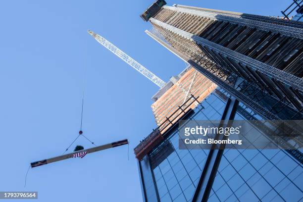 Steel beam is raised during an event at 270 Park Avenue, JPMorgan Chase's new global headquarters building, in New York, US, on Monday, Nov. 20,...