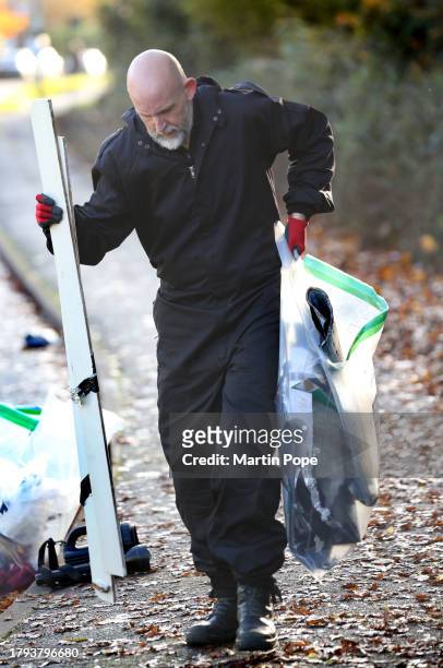 Specialist police officer takes away parts of the lock-ons as evidence on November 20, 2023 in Leicester, United Kingdom. Activists with the group...