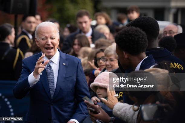 President Joe Biden greets audience members after pardoning the National Thanksgiving turkeys Liberty and Bell during a ceremony on the South Lawn of...