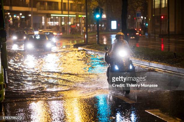 Cars pass through puddles after the rain on the Chaussée d'Etterbeek on November 20, 2023 in Brussels, Belgium. This Monday marked the return of rain...