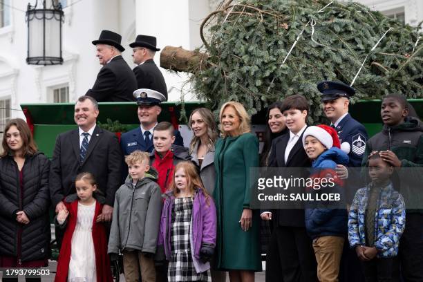 First Lady Jill Biden receives the official 2023 White House Christmas Tree, an 18.5 foot Fraser Fir from Fleetwood, North Carolina, which will stand...