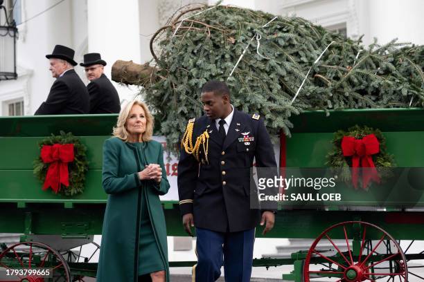 First Lady Jill Biden receives the official 2023 White House Christmas Tree, an 18.5 foot Fraser Fir from Fleetwood, North Carolina, which will stand...