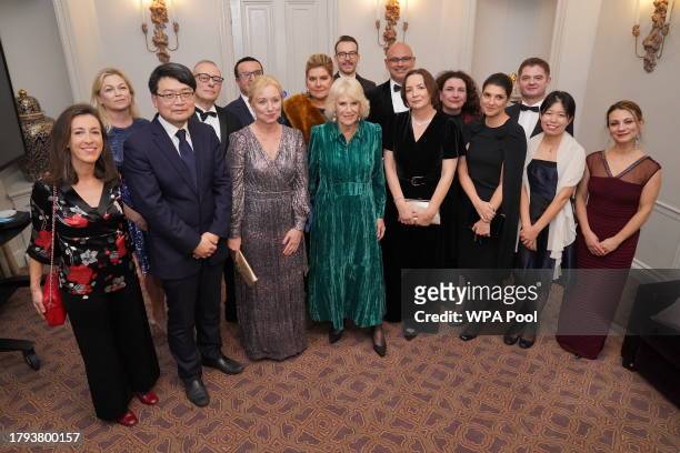 Queen Camilla poses with Foreign Press Association director Deborah Bonetti , president Dagmar Seeland and committee members at the annual awards...