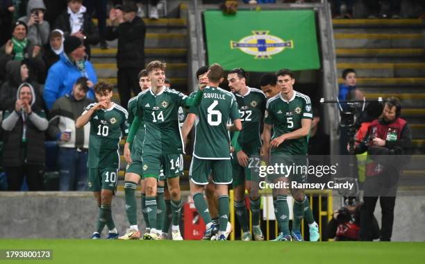 Belfast , United Kingdom - 20 November 2023; Isaac Price of Northern Ireland celebrates with teammates after scoring his side's first goal during the...