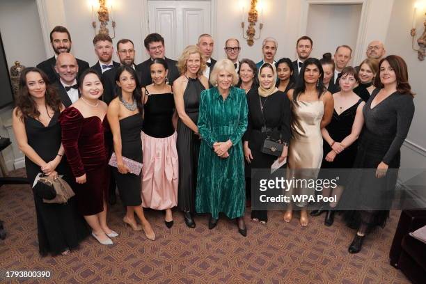 Queen Camilla poses with award nominees at the annual Foreign Press Association awards, which is celebrating its 135th anniversary, at Sheraton Grand...