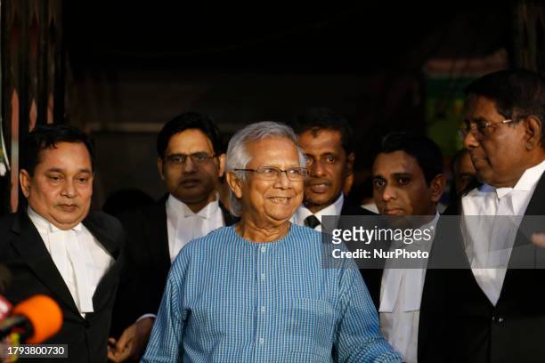 Nobel Peace Prize laureate and Grameen Telecom chairman Professor Muhammad Yunus with his lawyers seen seen in front of a labor court in Dhaka,...