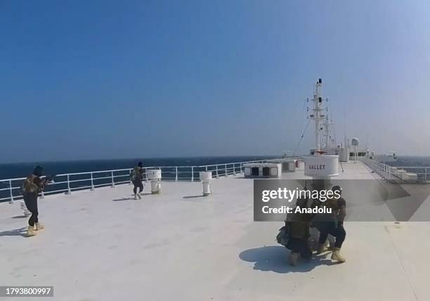 Screen grab captured from a video shows that cargo ship 'Galaxy Leader', co-owned by an Israeli company, being hijacked by Iran-backed Houthis from...