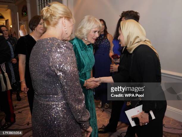 Queen Camilla speaks to a nominee at the annual awards ceremony which is celebrating its 135th anniversary at Sheraton Grand London Park Lane on...