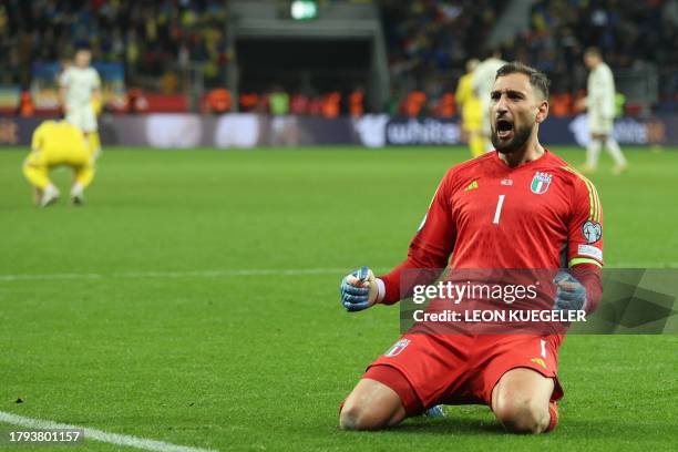 Italy's goalkeeper Gianluigi Donnarumma celebrates at the final whistle of the UEFA EURO 2024 Group C qualifying football match between Ukraine and...