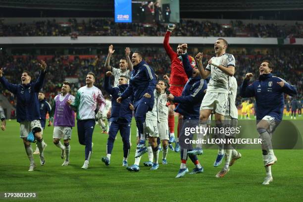 Italy's players celebrates after the final whistle of the UEFA EURO 2024 Group C qualifying football match between Ukraine and Italy at the BayArena...