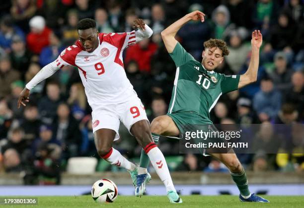 Denmark's midfielder Mohamed Daramy vies with Northern Ireland's striker Dion Charles during the UEFA Euro 2024 Group H qualifying football match...