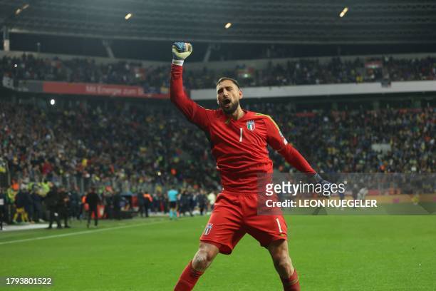 Italy's goalkeeper Gianluigi Donnarumma celebrates at the final whistle of the UEFA EURO 2024 Group C qualifying football match between Ukraine and...