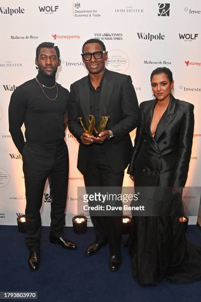 Malachi Kirby, David Harewood, winner of the Great Creative Briton award, and Sabina Emrit Harper attend the Walpole British Luxury Awards 2023 at...