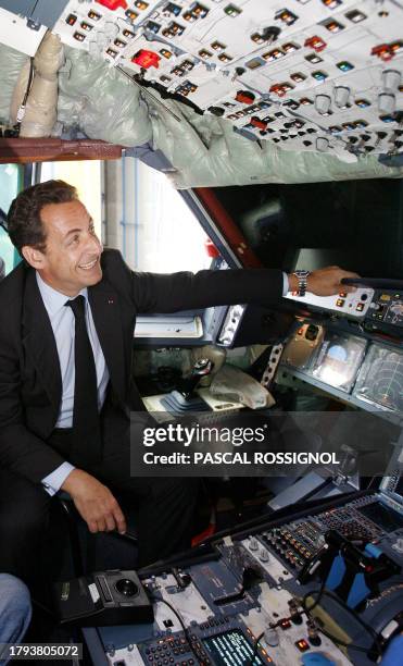 French President Nicolas Sarkozy sits in the cabin of a A330 Airbus in built, 18 May 2007 at the Airbus plant in Toulouse, southwestern France....