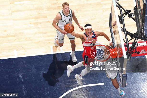 Landry Shamet of the Washington Wizards drives to the basket during the game against the Milwaukee Bucks on November 20, 2023 at Capital One Arena in...