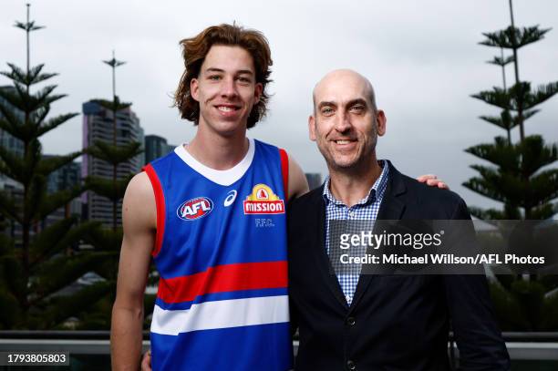 Jordan Croft of the Bulldogs and father Matthew Croft are seen during the AFL Draft Media Opportunity at Marvel Stadium on November 21, 2023 in...