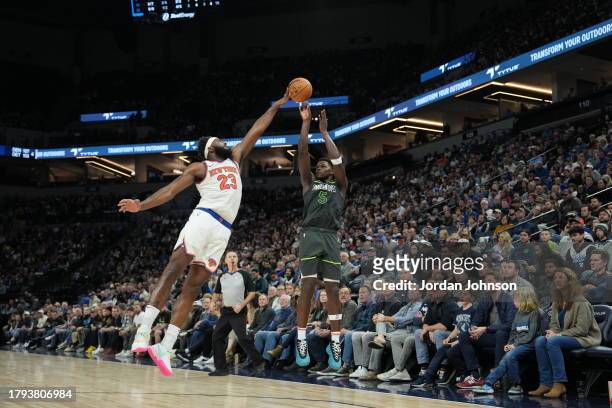 Mitchell Robinson of the New York Knicks blocks Anthony Edwards of the Minnesota Timberwolves on November 20, 2023 at Target Center in Minneapolis,...
