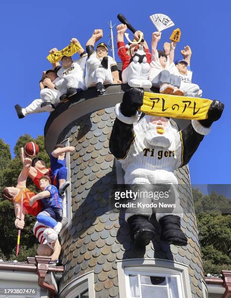 Photo taken on Nov. 21 shows a Santa Claus figure wearing a Hanshin Tigers baseball jersey atop the Uroko no Ie in the historical Kitano Ijinkan...