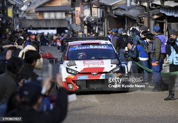 Britain's Elfyn Evans drives his Toyota GR Yaris Rally1 Hybrid through a street in Ena, Gifu Prefecture, central Japan, during the Rally Japan motor...