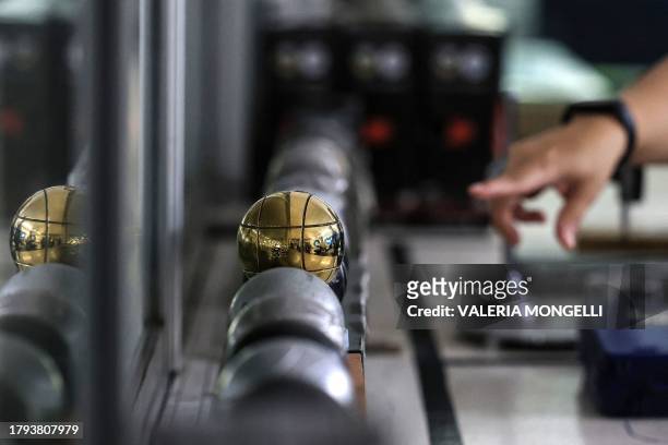 This photo taken on November 8, 2023 shows petanque balls in the inspection room at Football Thai Factory Sporting Goods in Bangkok. Half a world...