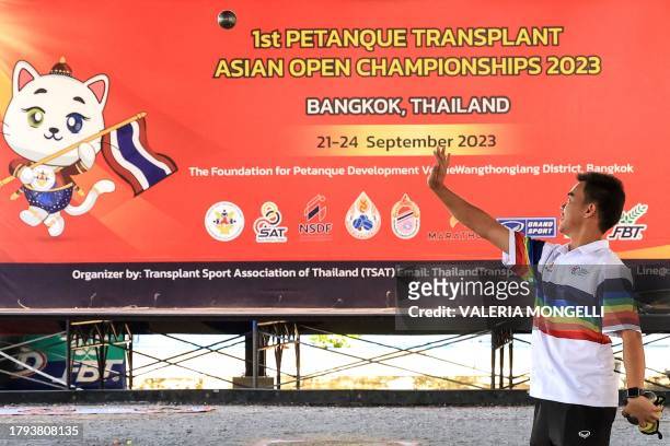 This photo taken on November 8, 2023 shows Ratchata Khamdee winner of the men's single and men triple categories of the last Petanque...