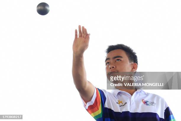 This photo taken on November 8, 2023 shows Ratchata Khamdee winner of the men's single and men triple categories of the last Petanque...