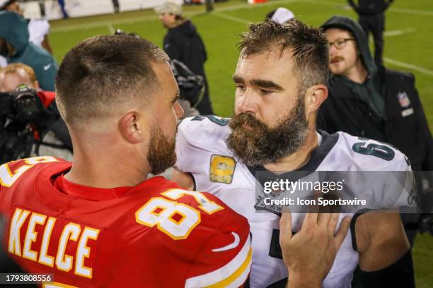 Philadelphia Eagles center Jason Kelce and Kansas City Chiefs tight end Travis Kelce hug after an NFL football game between the Philadelphia Eagles...